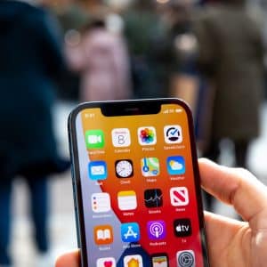 iPhone 12 in hand