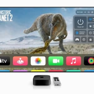 Screenshot of Apple TV running tvOS 26, showcasing the visionOS-inspired translucent interface with frosted-glass menus, highlighting new gaming app and Wi-Fi syncing features for 2025.